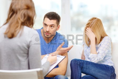 love, family, phychology and relationship problems concept - young couple with a problem at psychologist office Stock Photo - 27329411